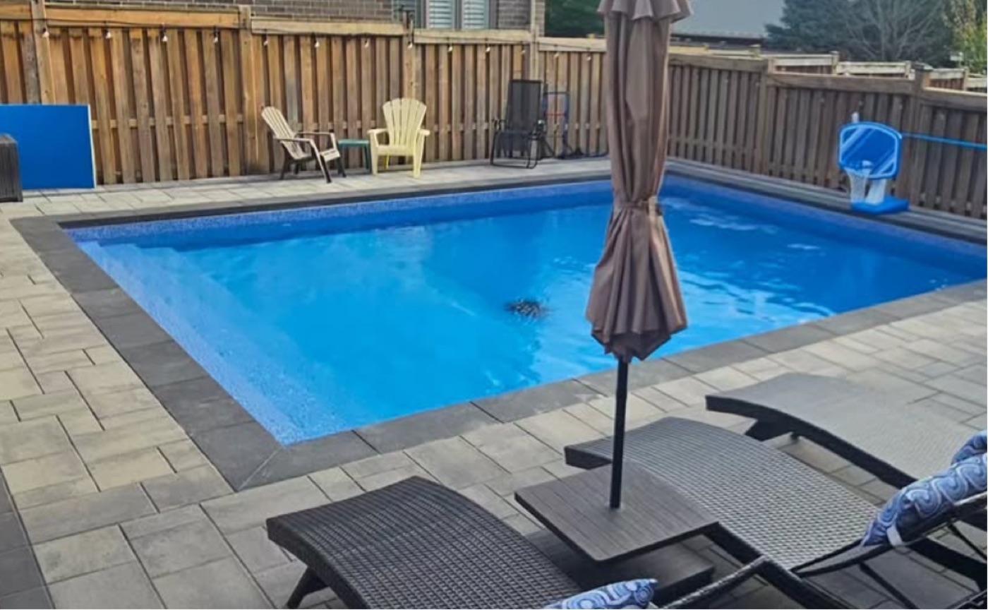 Finished inground pool and interlocking paver deck