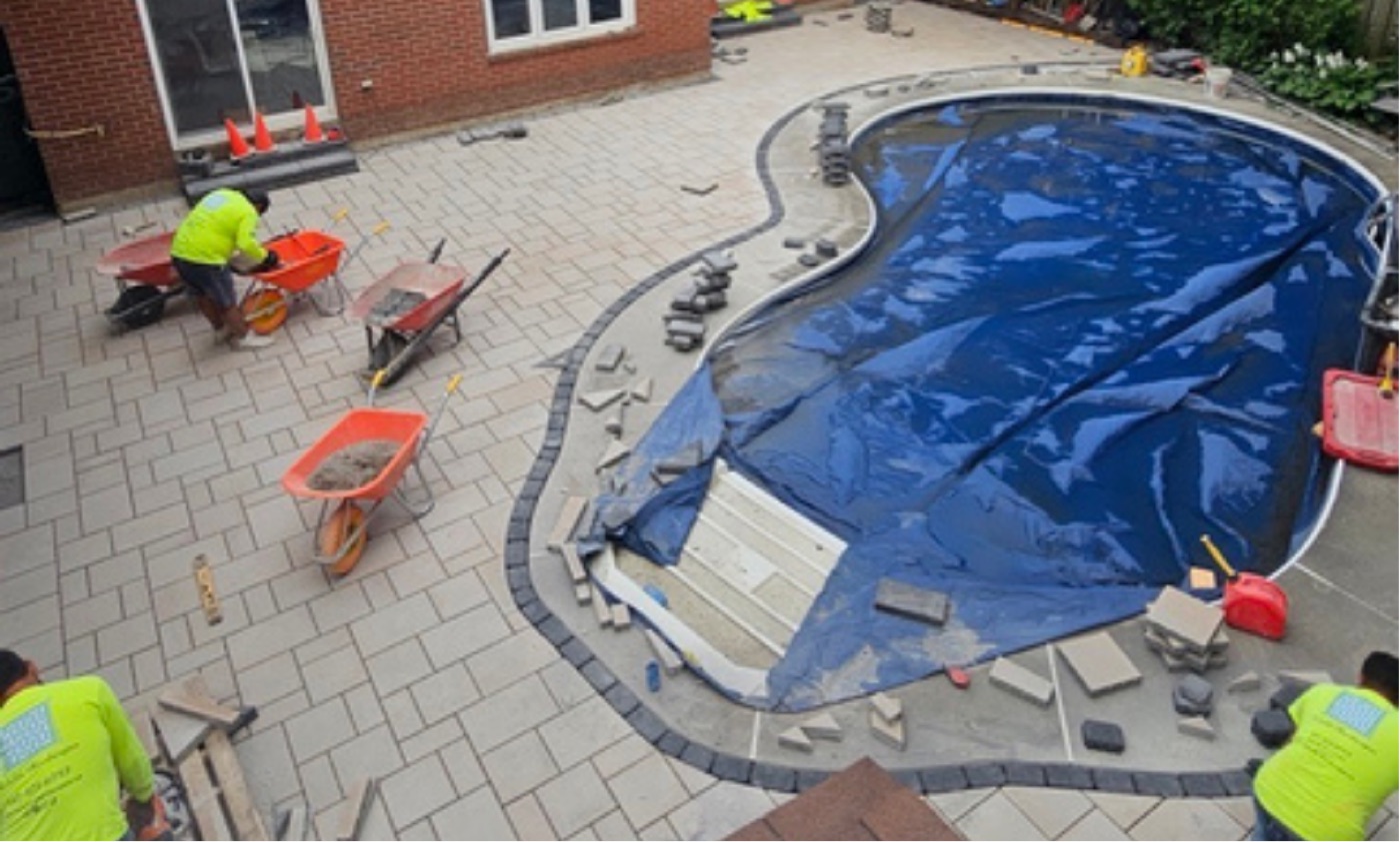 Curved inground pool with new paver patio